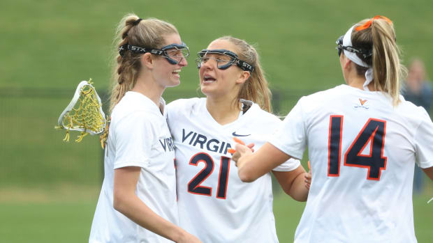 Mackenzie Hoeg celebrates with Kate Miller and Morgan Schwab after scoring a goal during the Virginia women's lacrosse game against Notre Dame at Klockner Stadium.
